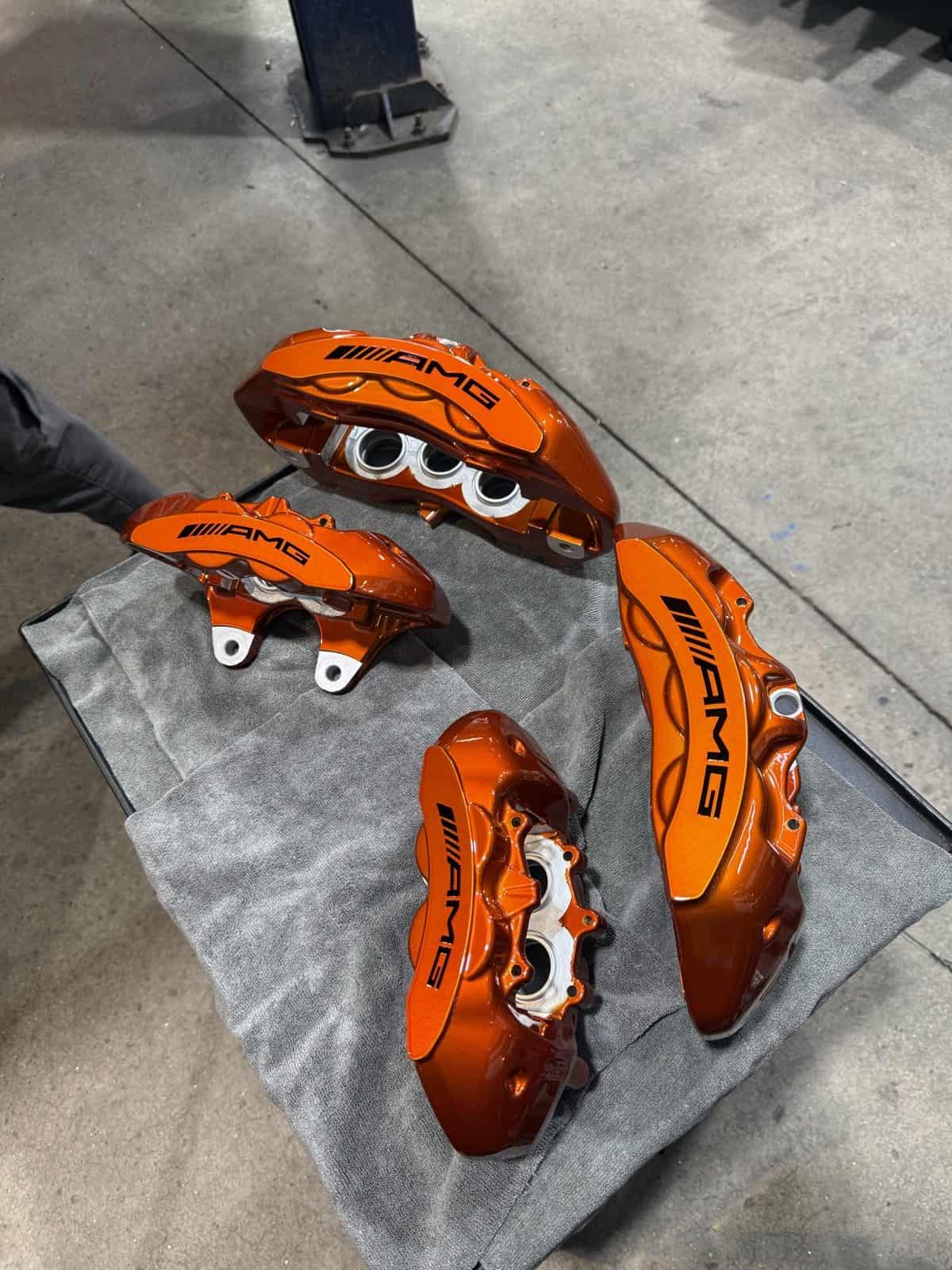 Set of four AMG orange powder coated brake calipers by ColorWerks Denver
