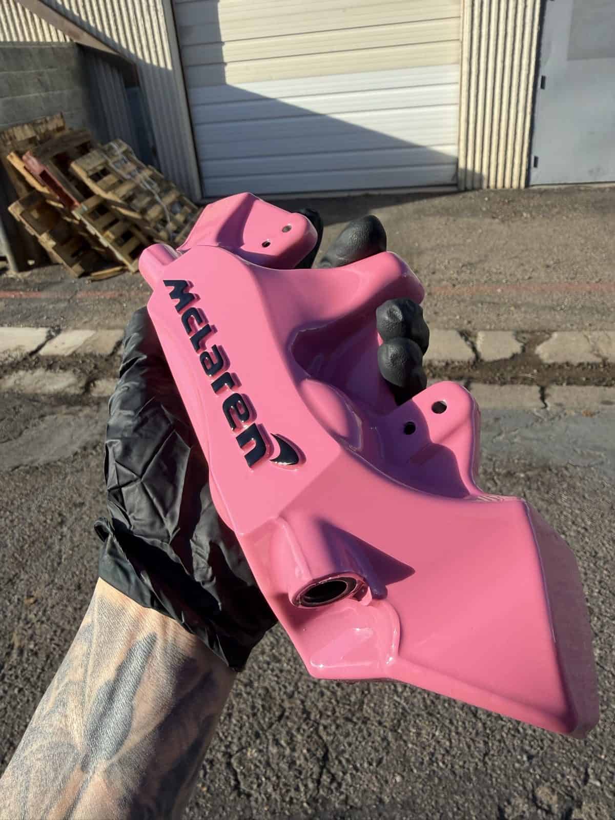 McLaren brake caliper powder coated in hot pink by ColorWerks Denver