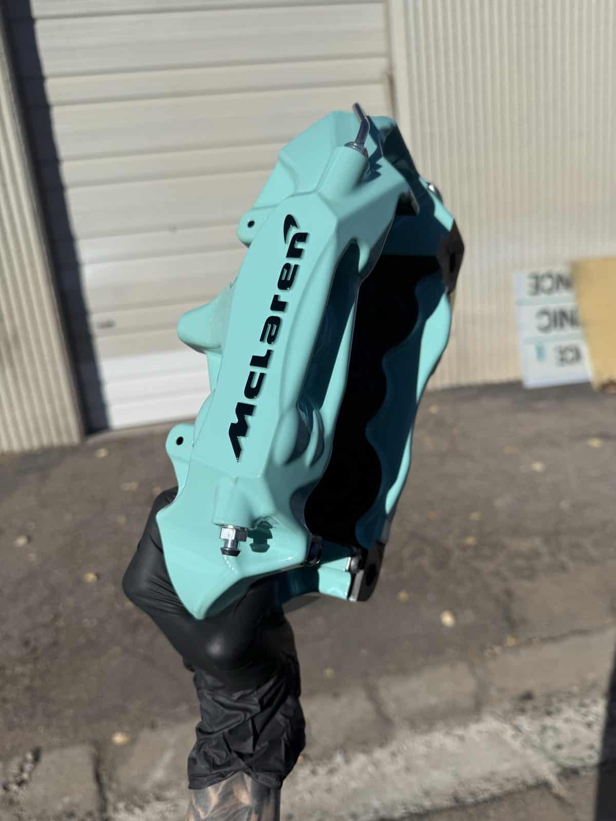McLaren brake caliper powder coated in teal mint green by ColorWerks Denver