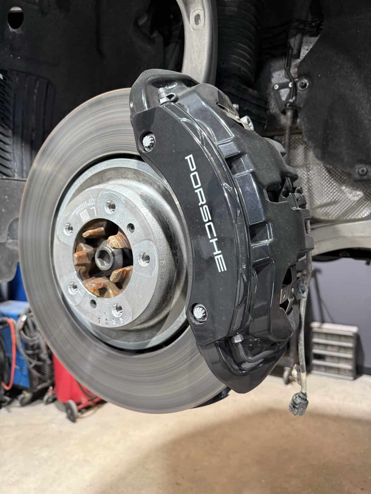 Porsche brake caliper before powder coating - black finish by ColorWerks Denver