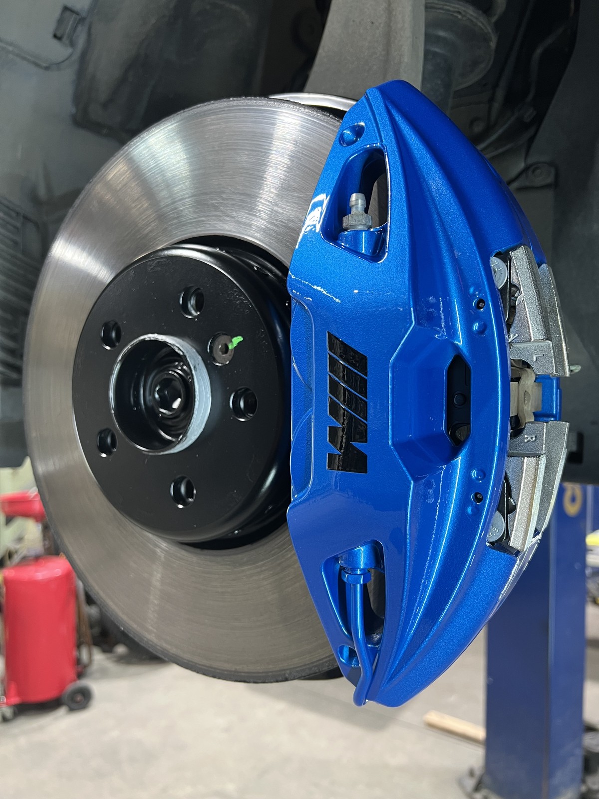 BMW M caliper after blue powder coating