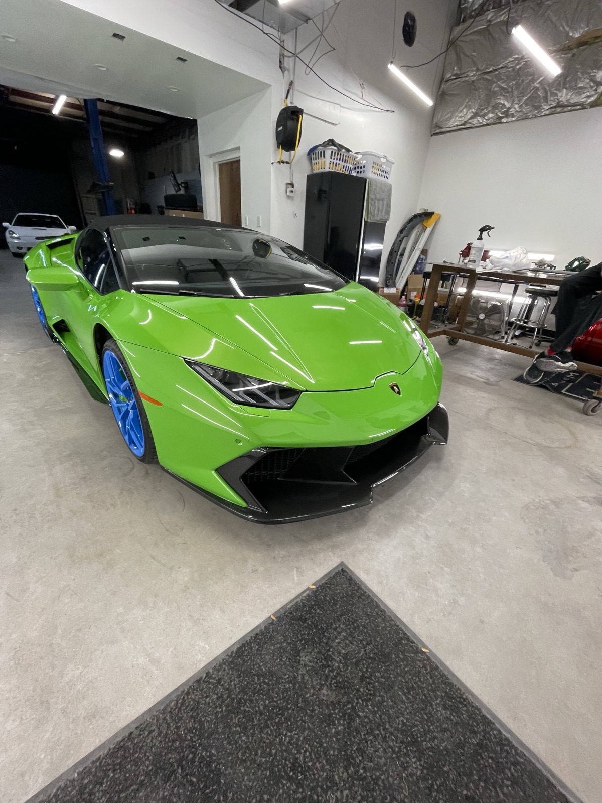 Green Lamborghini with blue powder coated wheels