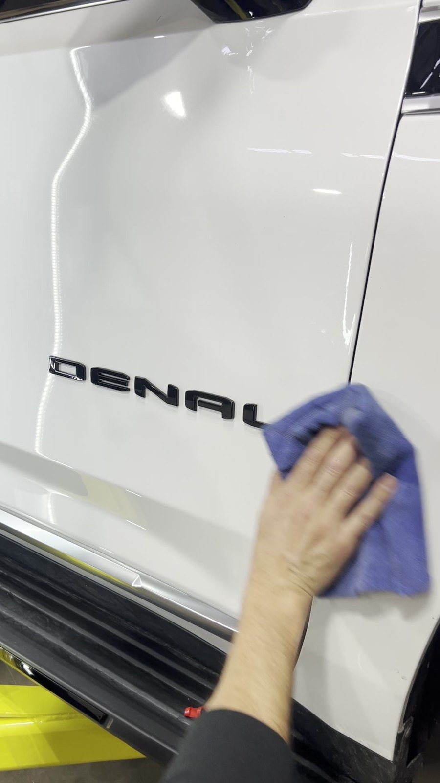 AFTER: Denali badge painted black and reinstalled on a white GMC, Denver