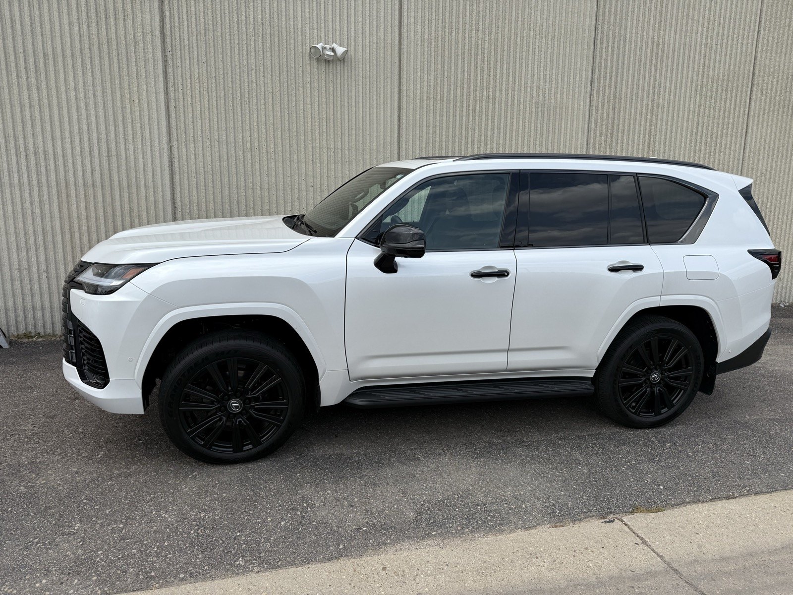 AFTER: White Lexus LX600 chrome delete with powder coated black wheels, Denver