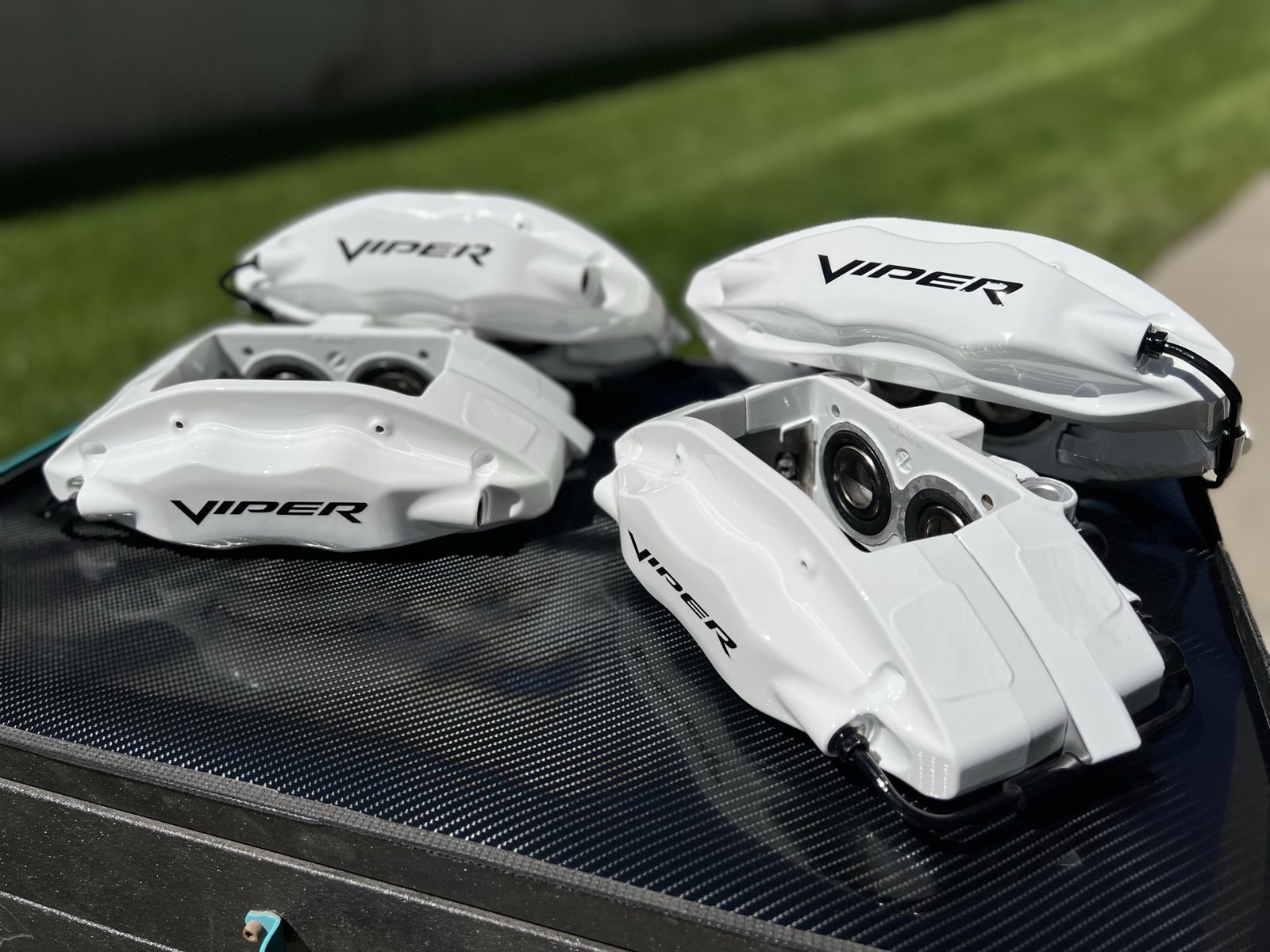 White powder coated brake calipers from a Dodge Viper