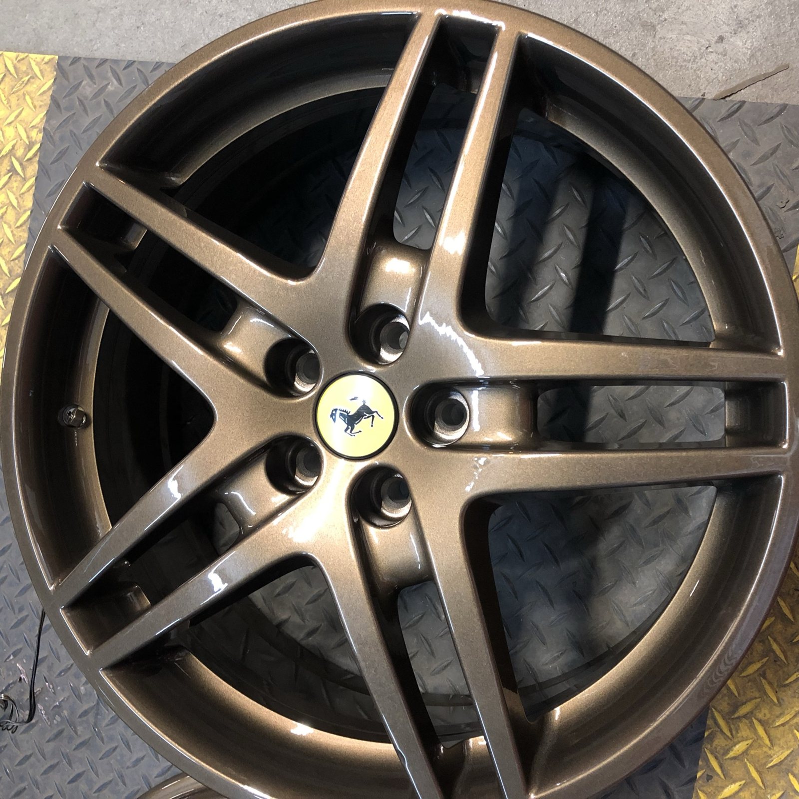 Bronze powder coated wheel on a Ferrari