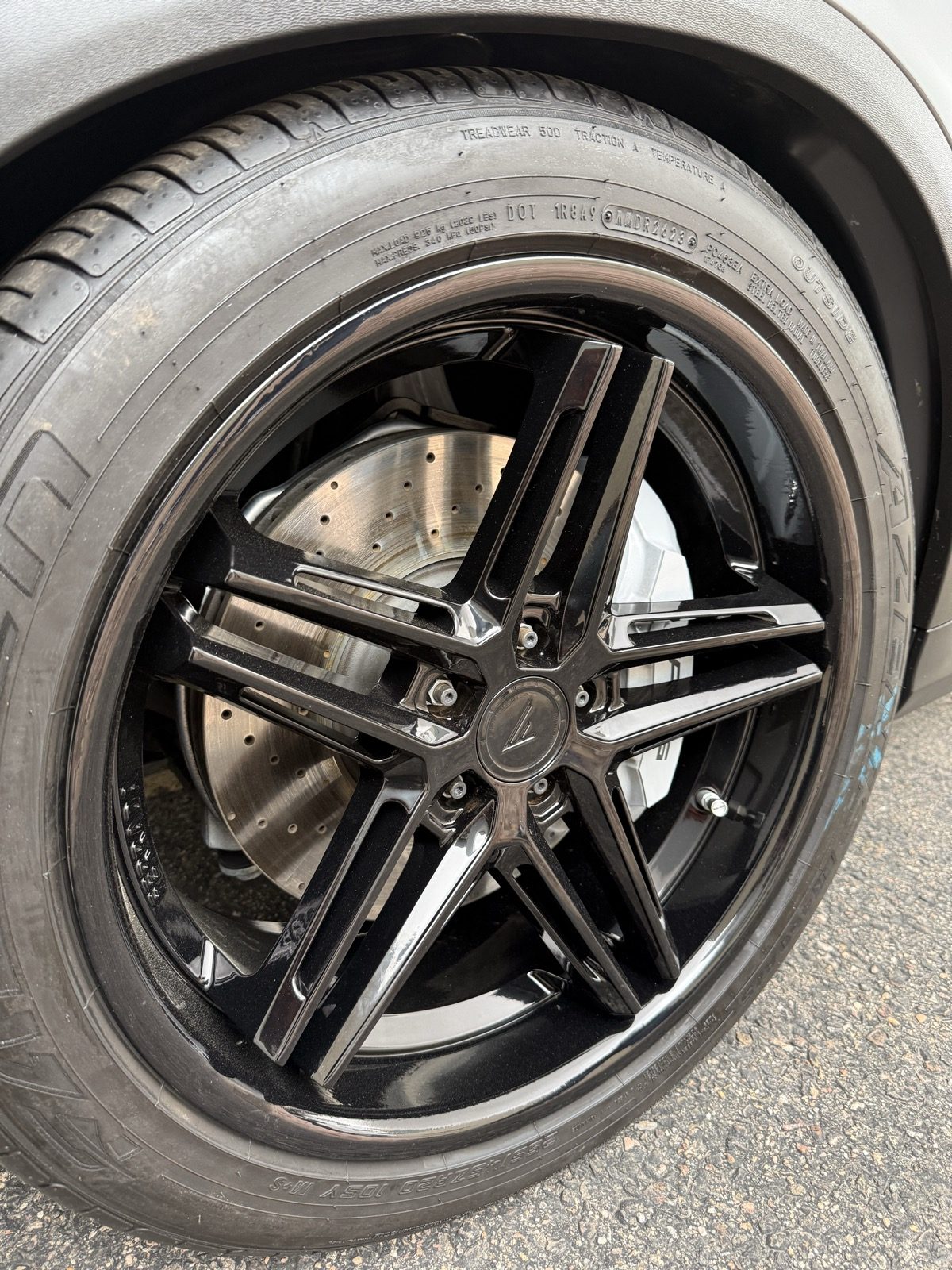 Gloss black powder coated wheel back on the car, same day