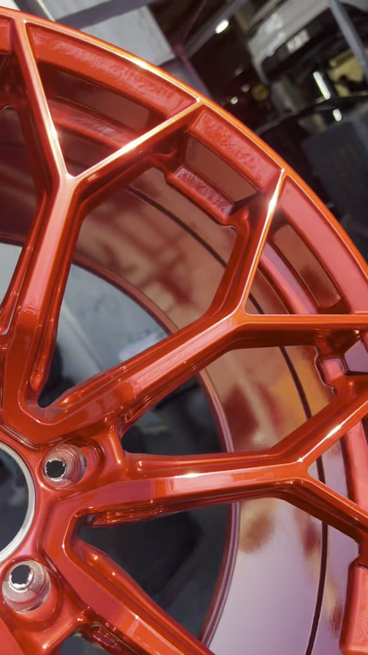 Close-up of a gloss red powder coated wheel