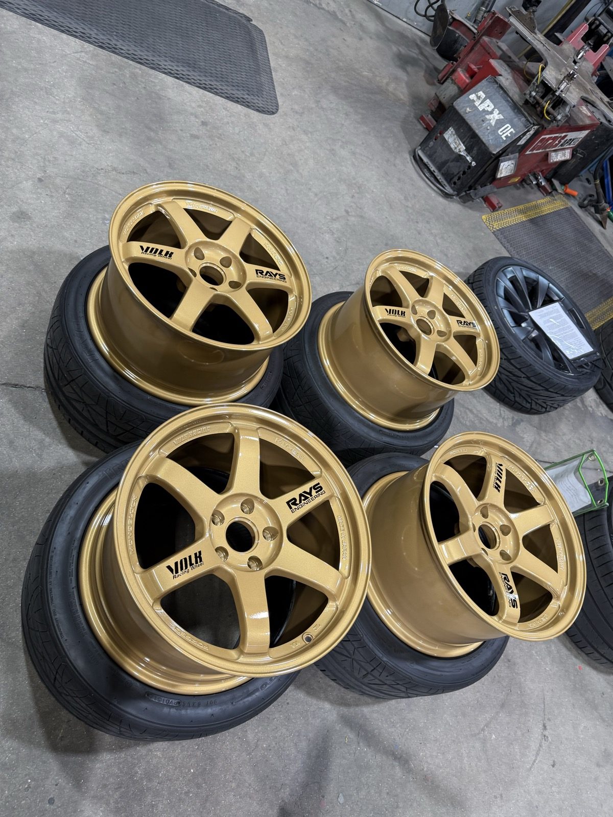 Set of four wheels powder coated gold, mounted on tires and ready for pickup