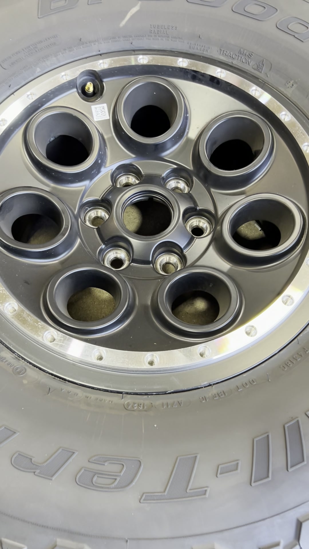 Matte black off-road wheel with a machined beadlock lip