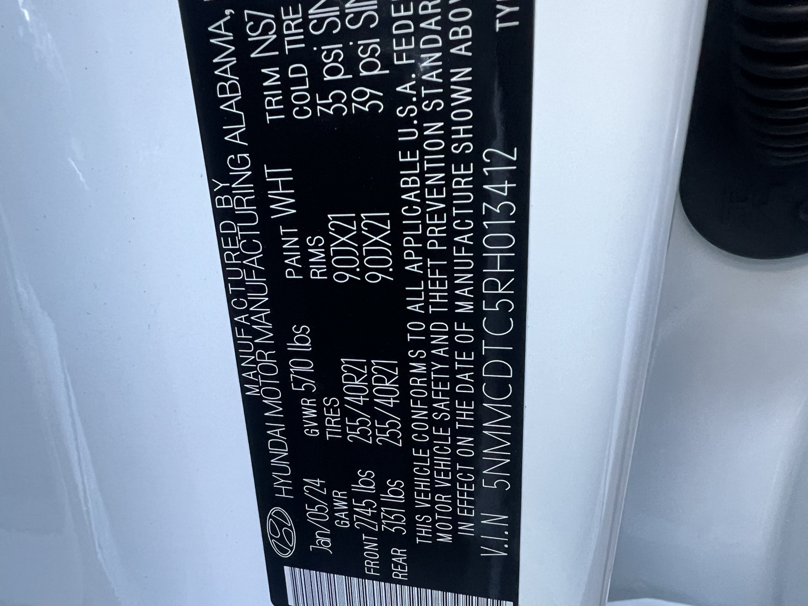 Factory paint code sticker in a door jamb, used for paint matching at ColorWerks Denver