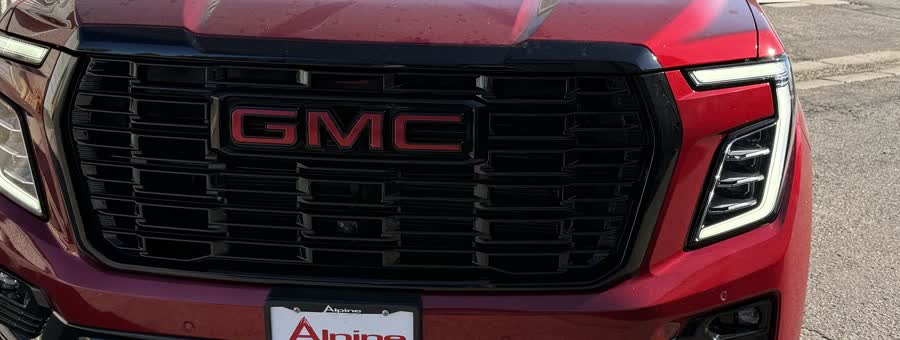Painted grille with a color-matched red emblem